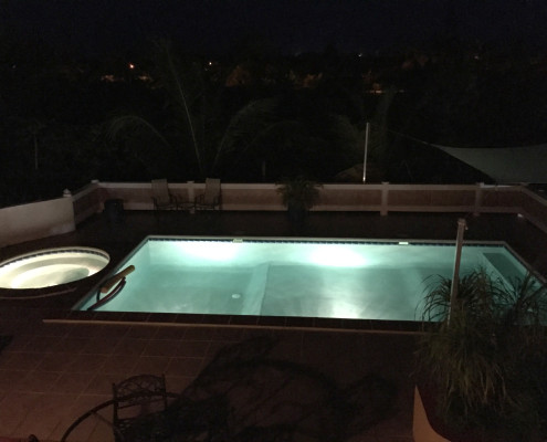Pool lights at night at ProvoVilla on Providenciales