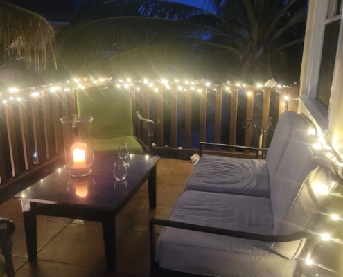 Deck at night with fairy lights | French Riviera (2nd floor condo)
