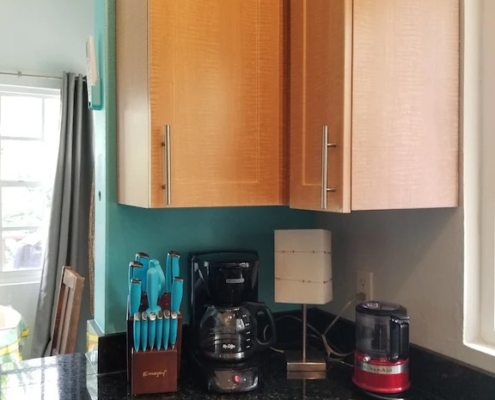 In the Kitchen with knives, coffee maker, and coffee grinder | French Riviera (2nd floor condo)